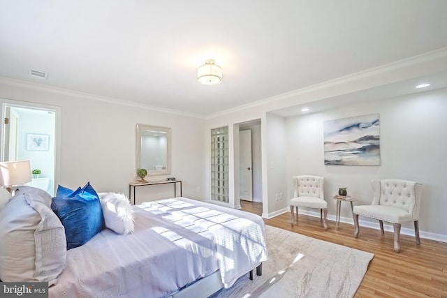 bedroom featuring ornamental molding and wood-type flooring