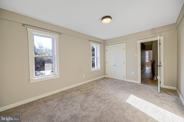 unfurnished bedroom with carpet floors