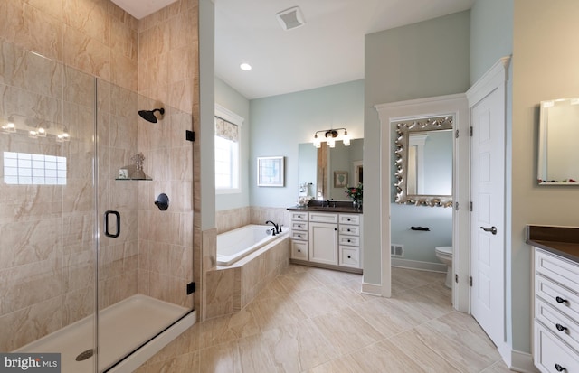 full bathroom with vanity, toilet, and shower with separate bathtub