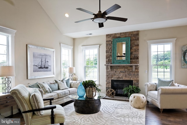 living room featuring vaulted ceiling, dark hardwood / wood-style floors, and plenty of natural light