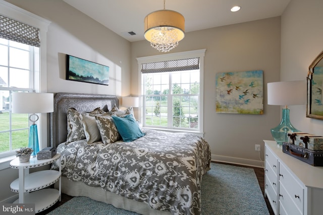 bedroom featuring multiple windows