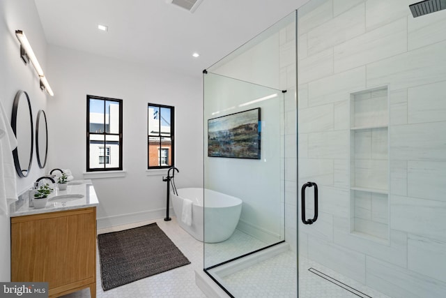 bathroom featuring vanity, tile patterned floors, and shower with separate bathtub