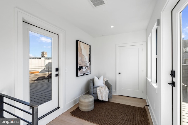 doorway to outside featuring light wood-type flooring