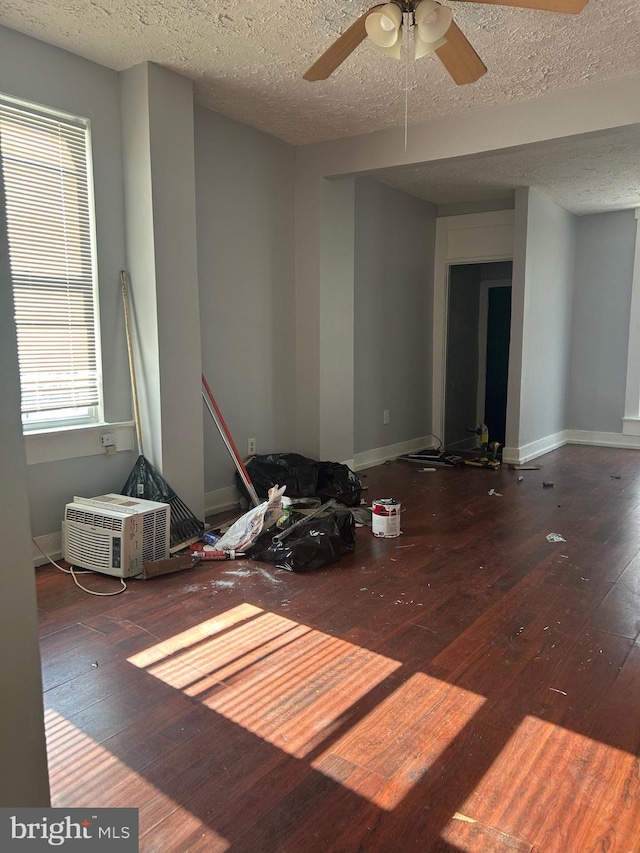 empty room featuring ceiling fan, a textured ceiling, and hardwood / wood-style floors