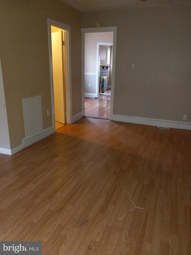 spare room with hardwood / wood-style flooring