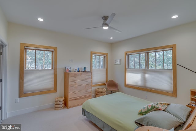 bedroom featuring light carpet and ceiling fan