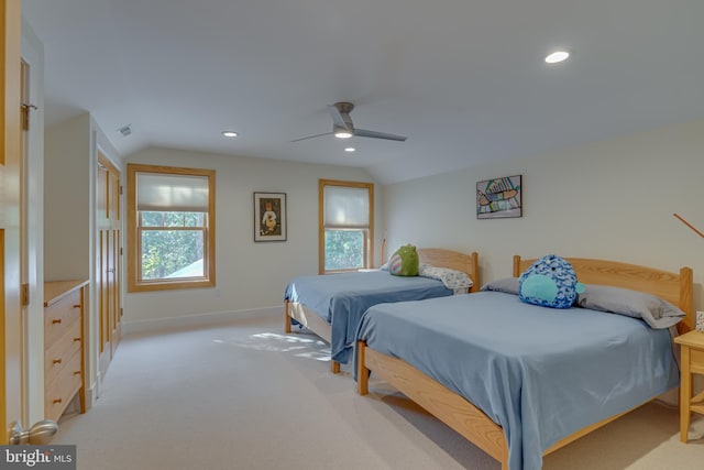 carpeted bedroom featuring lofted ceiling and ceiling fan