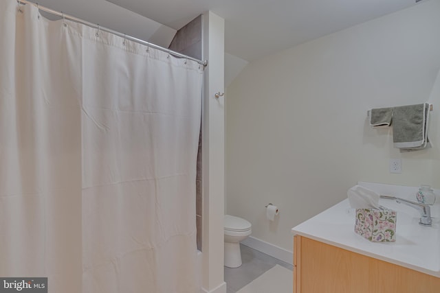 bathroom featuring vanity, toilet, a shower with curtain, and tile patterned flooring