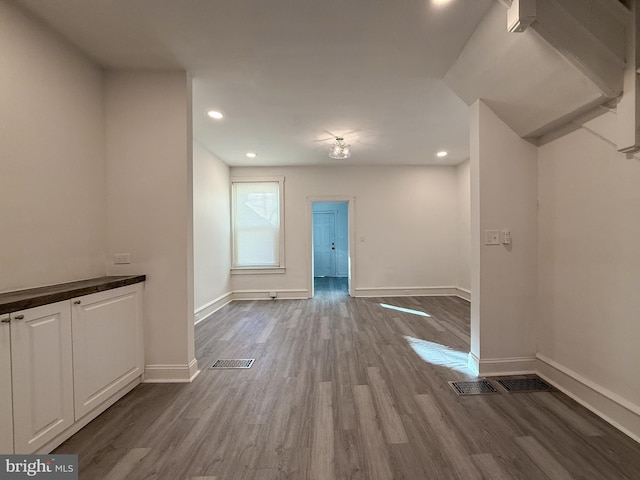 unfurnished living room featuring wood-type flooring