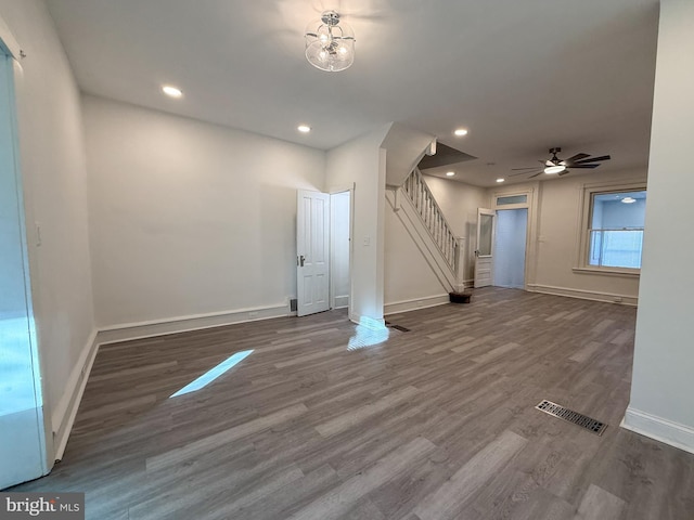 interior space with ceiling fan and wood-type flooring