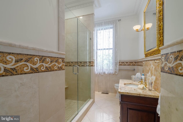 bathroom featuring toilet, tile walls, walk in shower, vanity, and ornamental molding