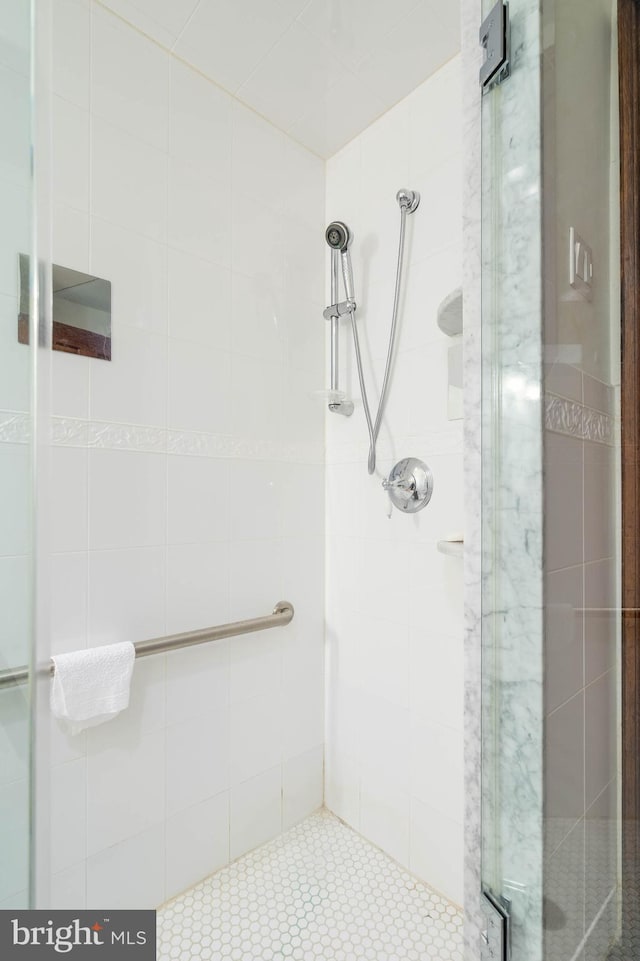 bathroom featuring an enclosed shower