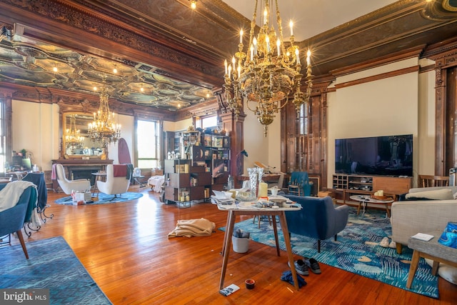 living room with crown molding and hardwood / wood-style flooring