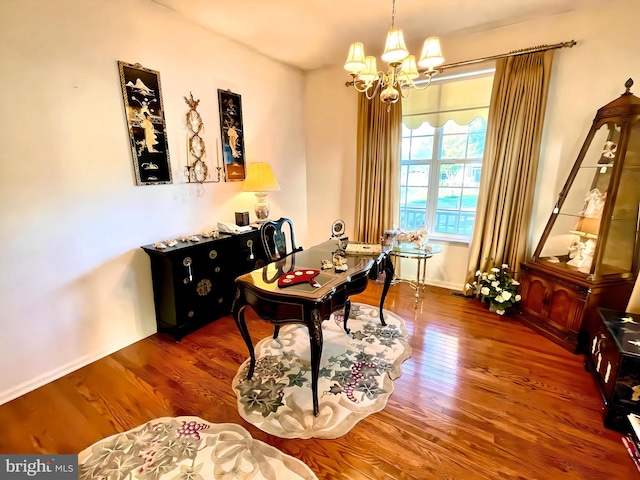 office area with hardwood / wood-style floors and a notable chandelier