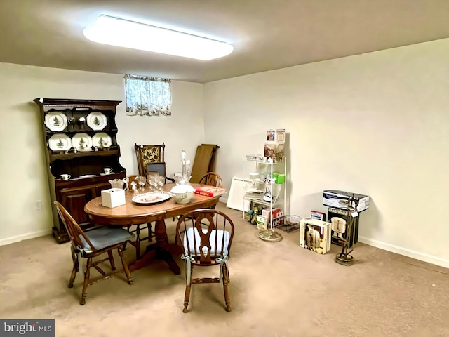 dining area featuring carpet flooring