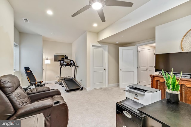 exercise area with ceiling fan and carpet flooring