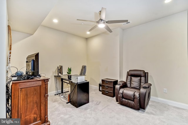 carpeted office space with ceiling fan