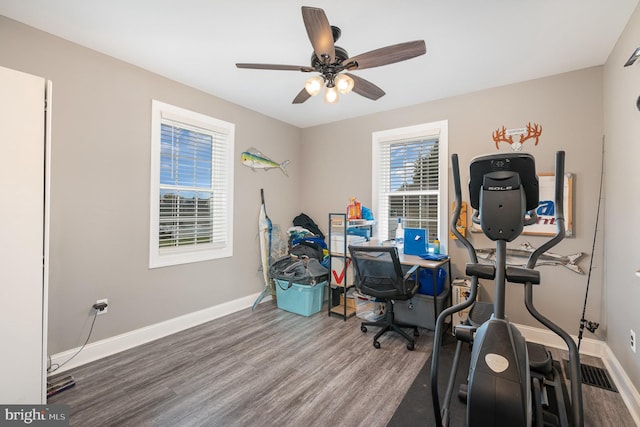 home office featuring wood-type flooring and ceiling fan