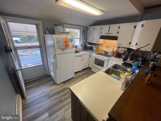 kitchen with white appliances, sink, light wood-type flooring, white cabinetry, and vaulted ceiling