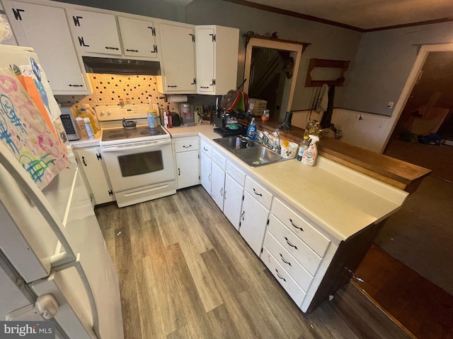 kitchen with light hardwood / wood-style flooring, sink, white cabinets, white appliances, and tasteful backsplash