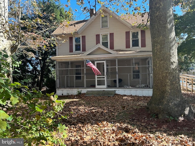 view of front of house with a sunroom