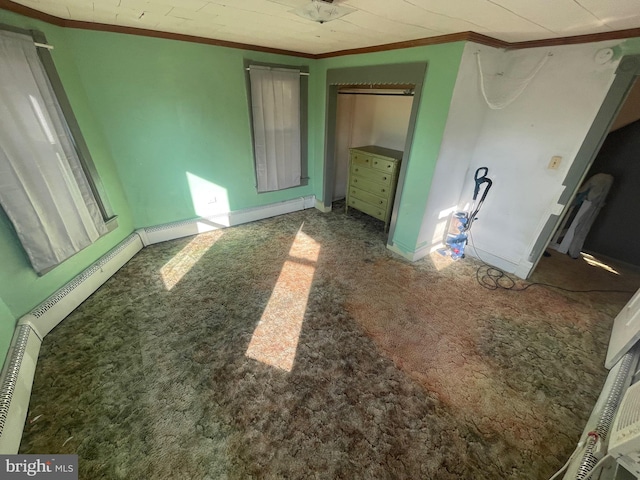 unfurnished bedroom featuring a baseboard radiator, carpet, and ornamental molding