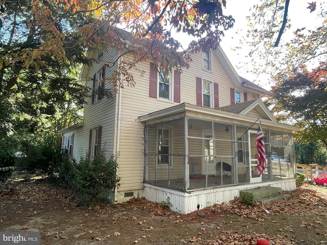 view of front of property featuring a sunroom