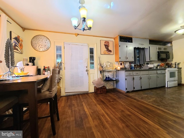 kitchen with ornamental molding, electric range, a chandelier, and dark hardwood / wood-style floors