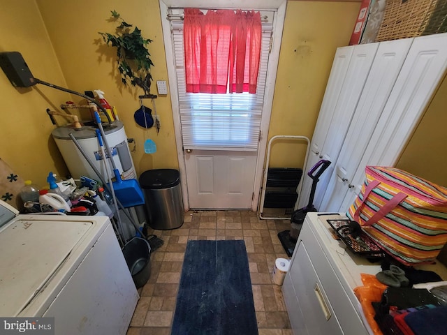 clothes washing area with washer / dryer