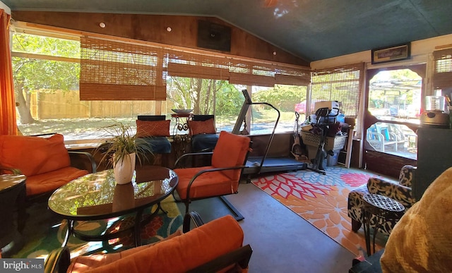 sunroom featuring vaulted ceiling