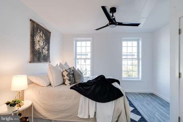 bedroom featuring hardwood / wood-style flooring and ceiling fan