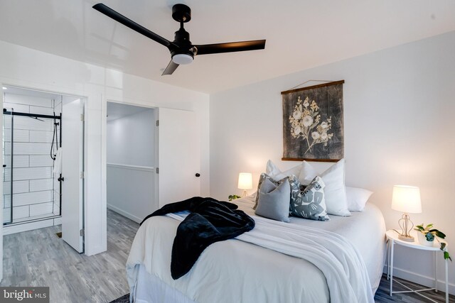 bedroom with wood-type flooring and ceiling fan