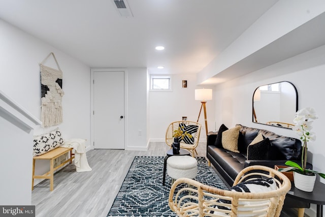 living room with light hardwood / wood-style floors