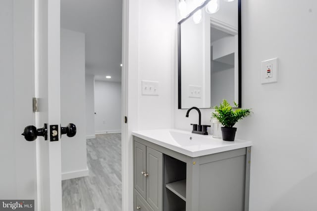 bathroom featuring vanity and hardwood / wood-style flooring