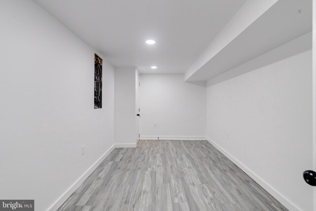 basement featuring light hardwood / wood-style flooring