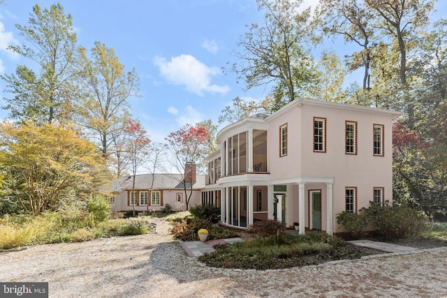 view of front of property with a sunroom