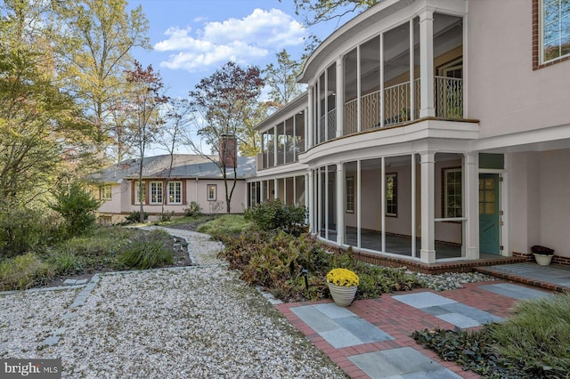 exterior space featuring a sunroom