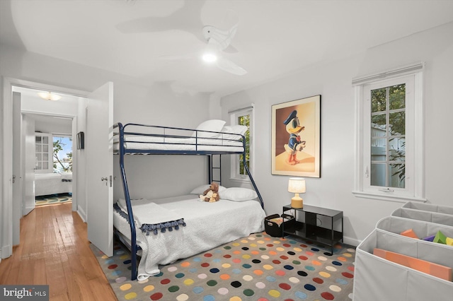 bedroom featuring wood-type flooring and ceiling fan