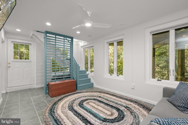 sunroom with ceiling fan