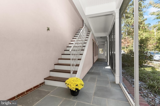 staircase with plenty of natural light