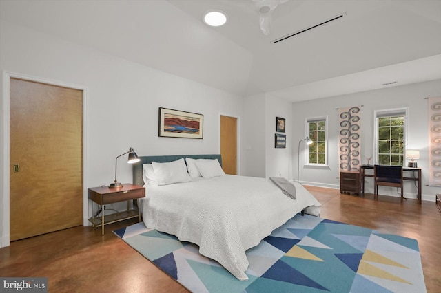 bedroom featuring lofted ceiling