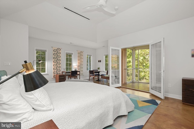 bedroom with concrete flooring, french doors, and ceiling fan