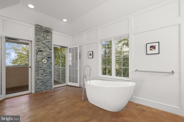 bathroom featuring a bath and concrete floors