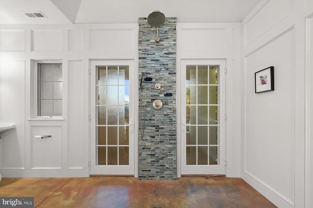 doorway with concrete floors