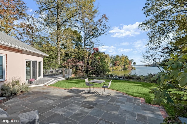 view of patio with a water view