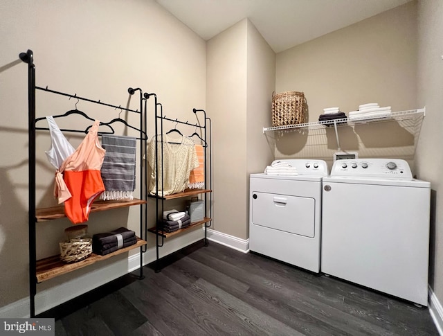 washroom featuring washing machine and dryer and dark hardwood / wood-style flooring