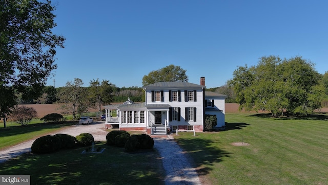 view of front of property with a front lawn