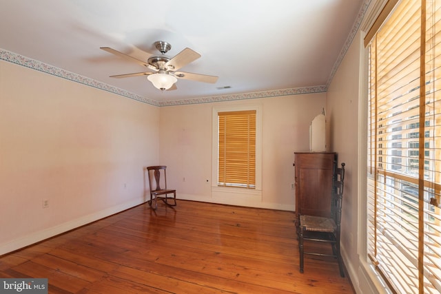 unfurnished room with hardwood / wood-style floors and ceiling fan