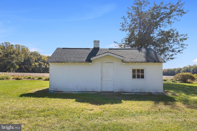 view of property exterior featuring a lawn