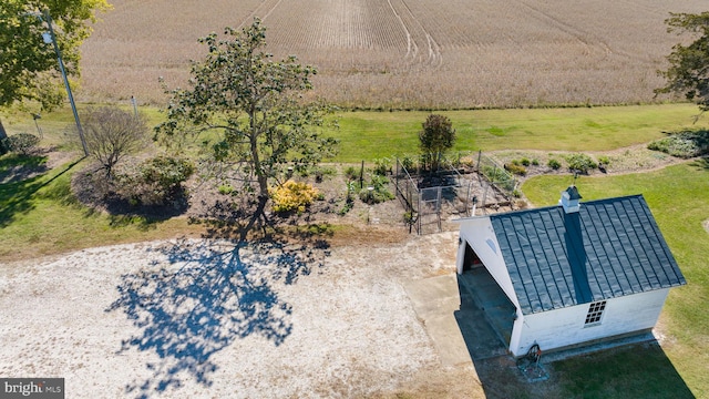 birds eye view of property with a rural view